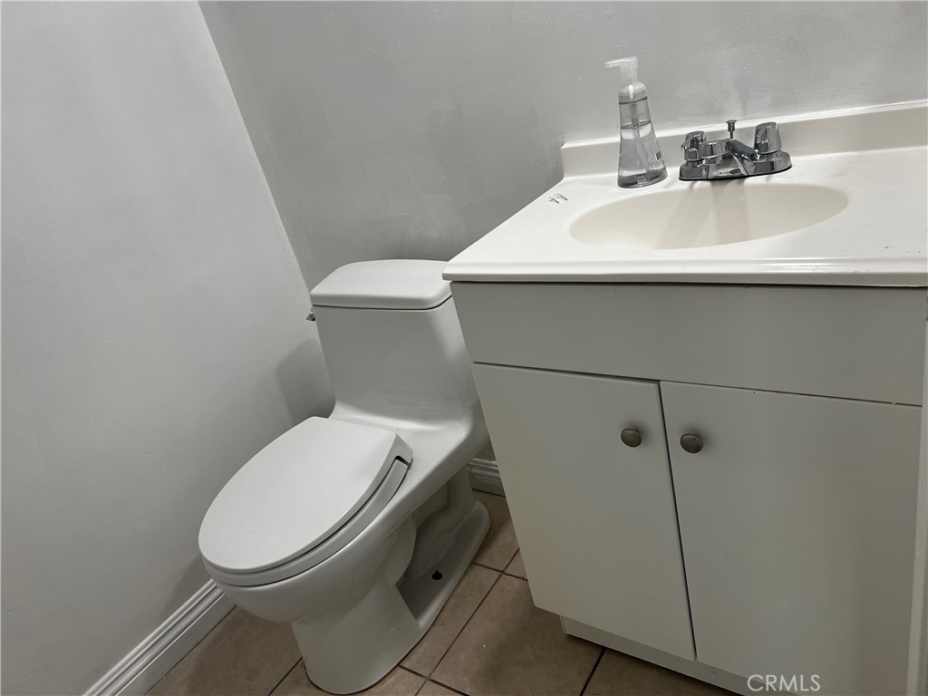 20524 Missionary Ridge Street Walnut, CA 91789 - Photo 14 of 26 a white toilet sitting next to a bathroom sink