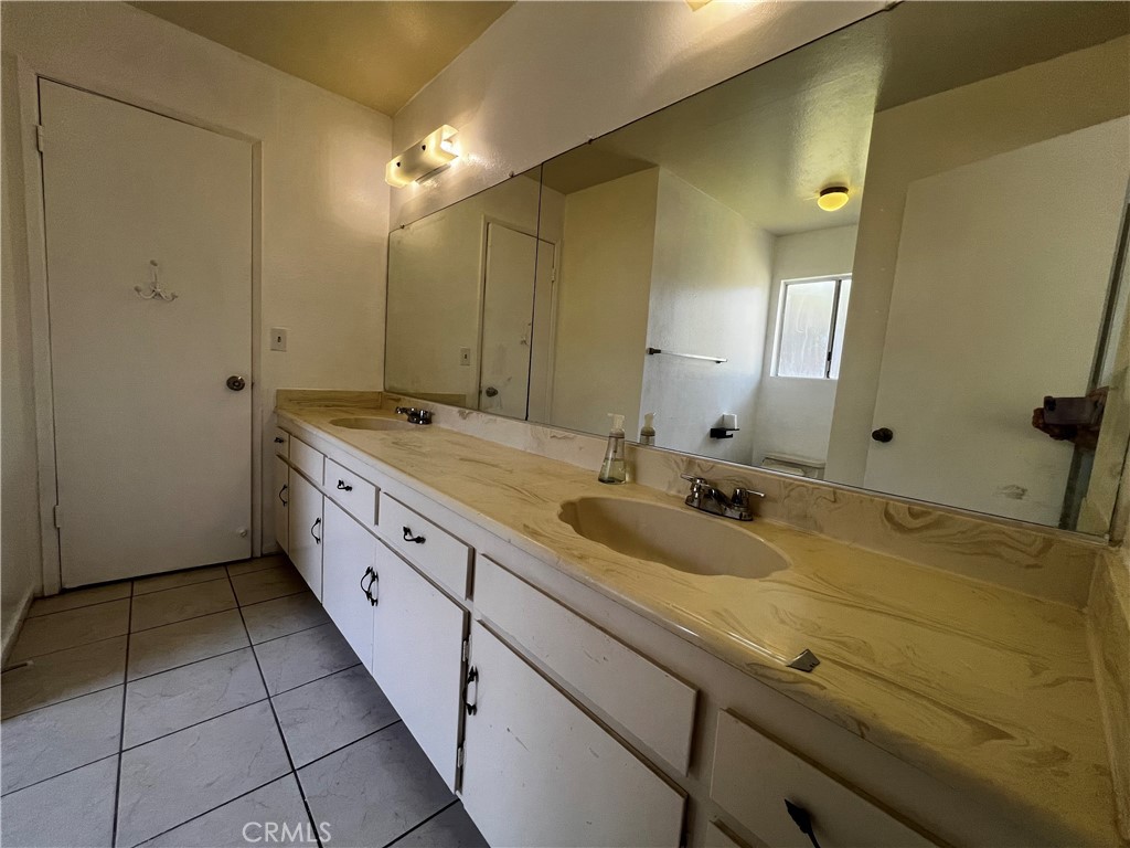 20524 Missionary Ridge Street Walnut, CA 91789 - Photo 17 of 26 a spacious bathroom with a granite countertop sink and a mirror
