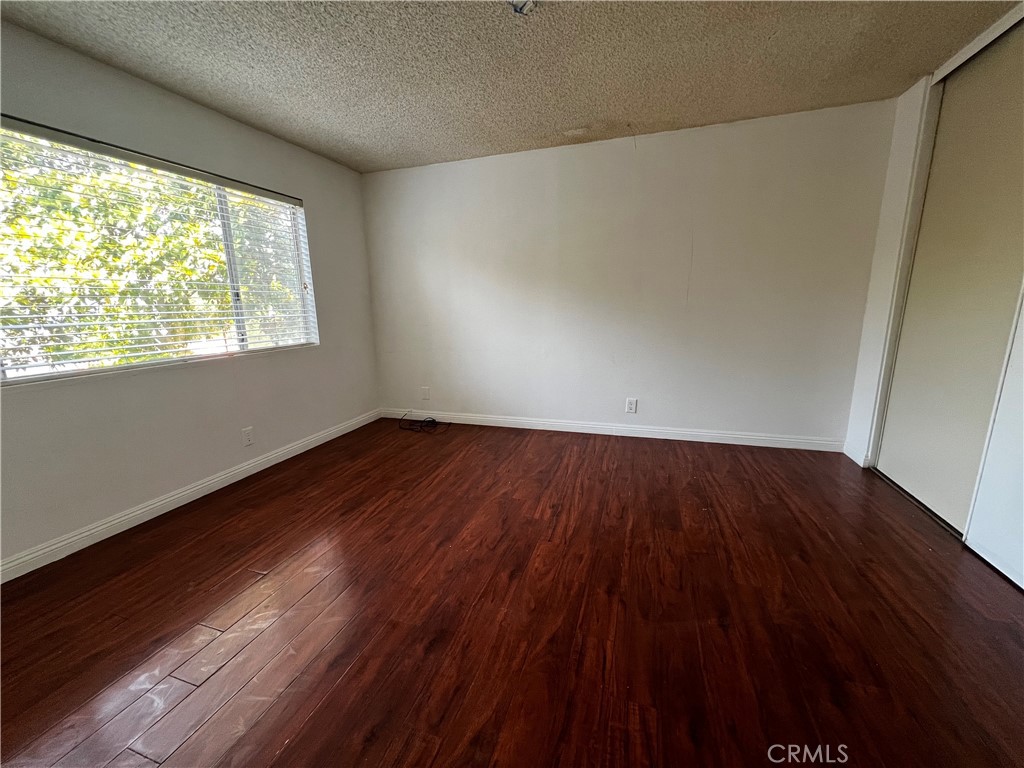 20524 Missionary Ridge Street Walnut, CA 91789 - Photo 18 of 26 a view of an empty room with wooden floor and a window