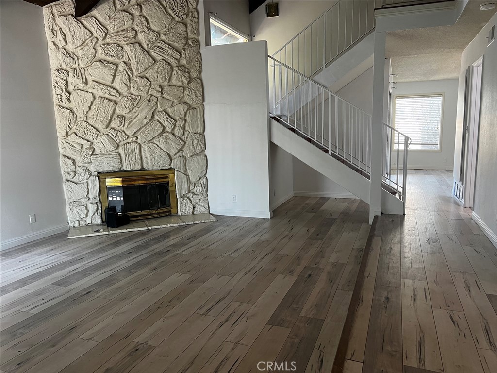 20524 Missionary Ridge Street Walnut, CA 91789 - Photo 3 of 26 a view of empty room with wooden floor and fireplace