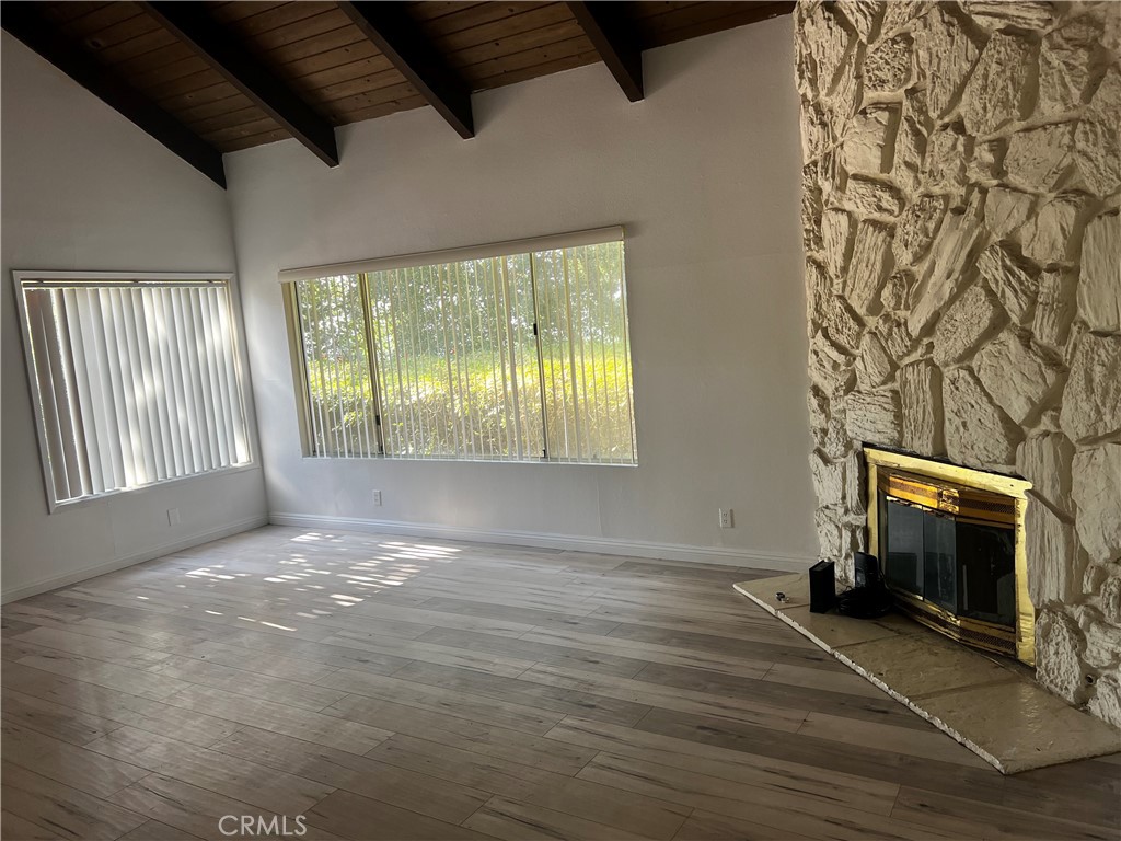 20524 Missionary Ridge Street Walnut, CA 91789 - Photo 4 of 26 a view of an empty room with a fireplace and a window