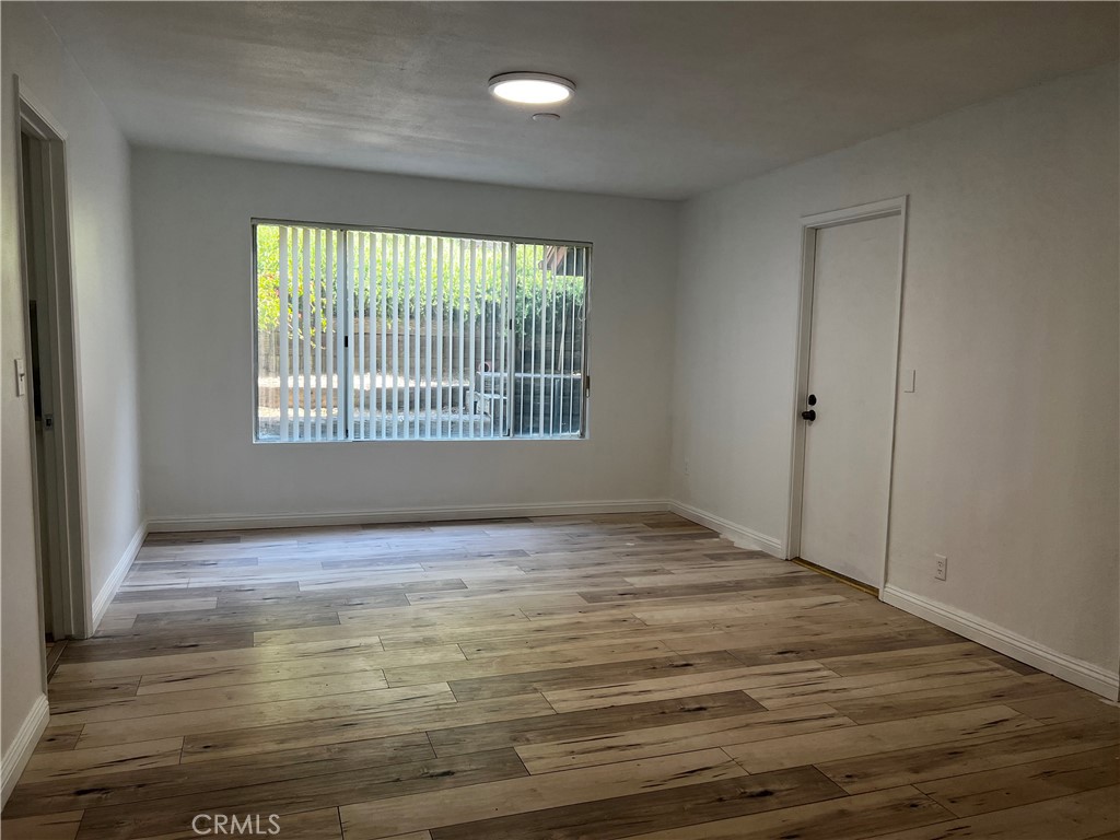 20524 Missionary Ridge Street Walnut, CA 91789 - Photo 5 of 26 a view of an empty room with wooden floor and a window
