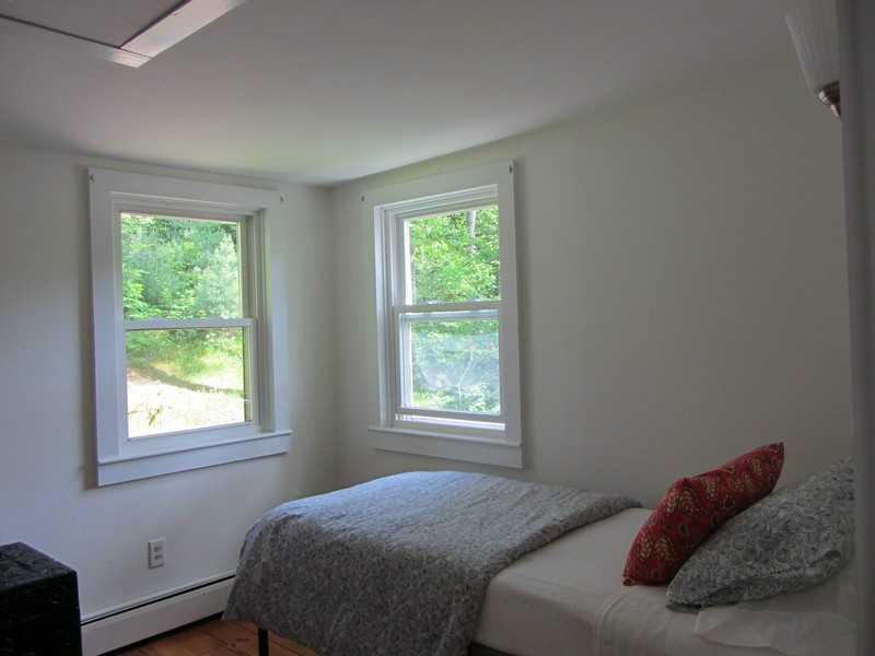89 Lakeview Road Boothbay Harbor, ME 04575 - Photo 26 of 28 Bedroom. This bedroom tucked in the...