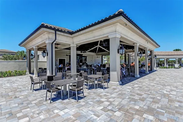 a outdoor space with lots of tables and chairs