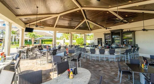 a view of a swimming pool with outdoor seating