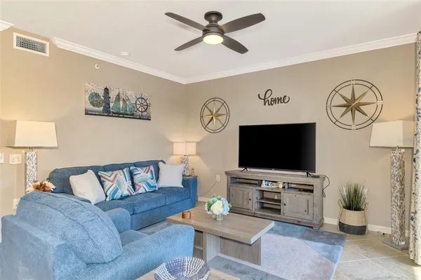 a living room with furniture and a flat screen tv