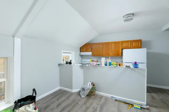 a kitchen with stainless steel appliances a sink and cabinets