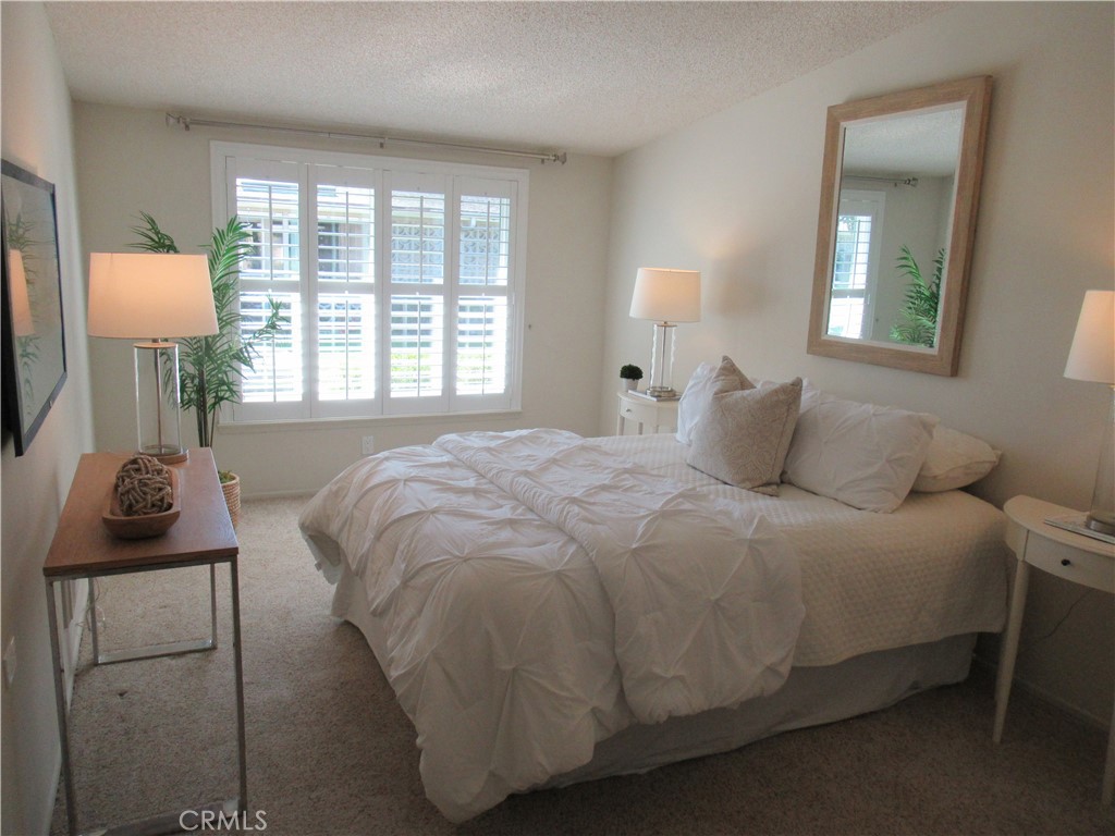 1230 Scioto Road Seal Beach, CA 90740 - Photo 22 of 27 a bedroom with a bed and window