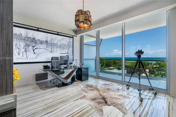 a living room with a large window and table