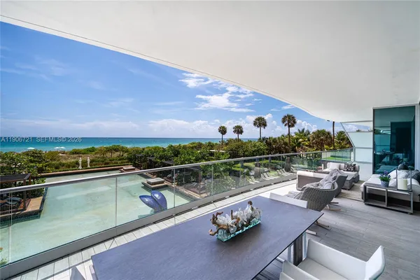 a view of swimming pool with outdoor seating