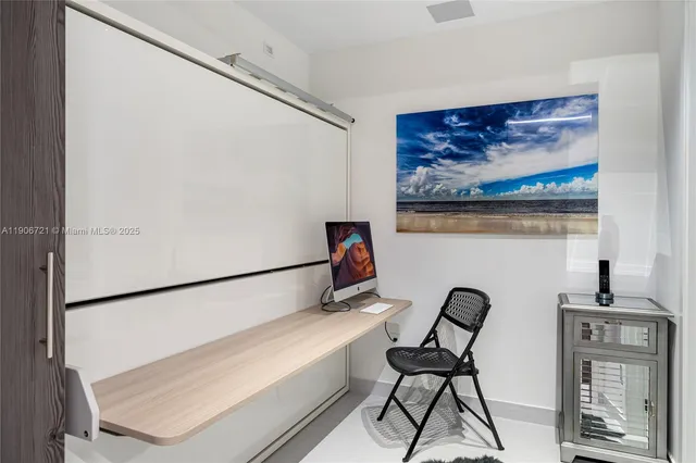 a view of a hallway with seating area