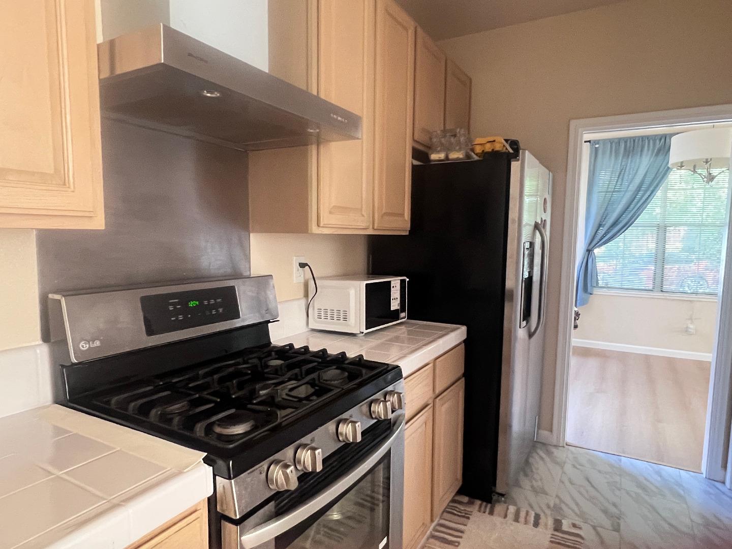 110 Whits Road Mountain View, CA 94040 - Photo 12 of 33 a kitchen with a stove and a refrigerator