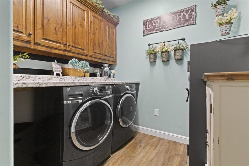 1195 Hog Town Road Collinsville, TX 76233 - Photo 25 of 37 a utility room with dryer and washer