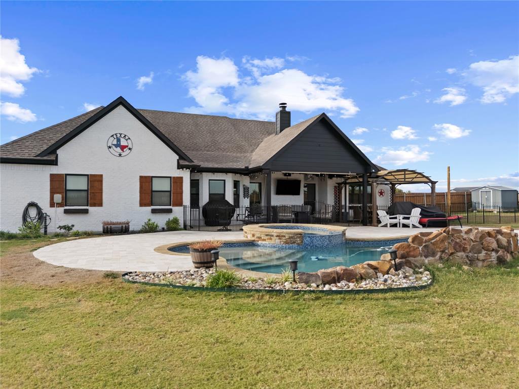 1195 Hog Town Road Collinsville, TX 76233 - Photo 26 of 37 a front view of a house with swimming pool having outdoor seating