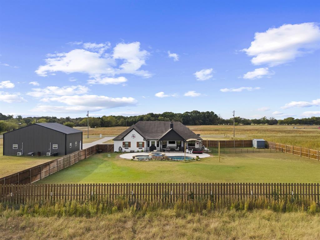 1195 Hog Town Road Collinsville, TX 76233 - Photo 30 of 37 a view of a lake with a house in the background