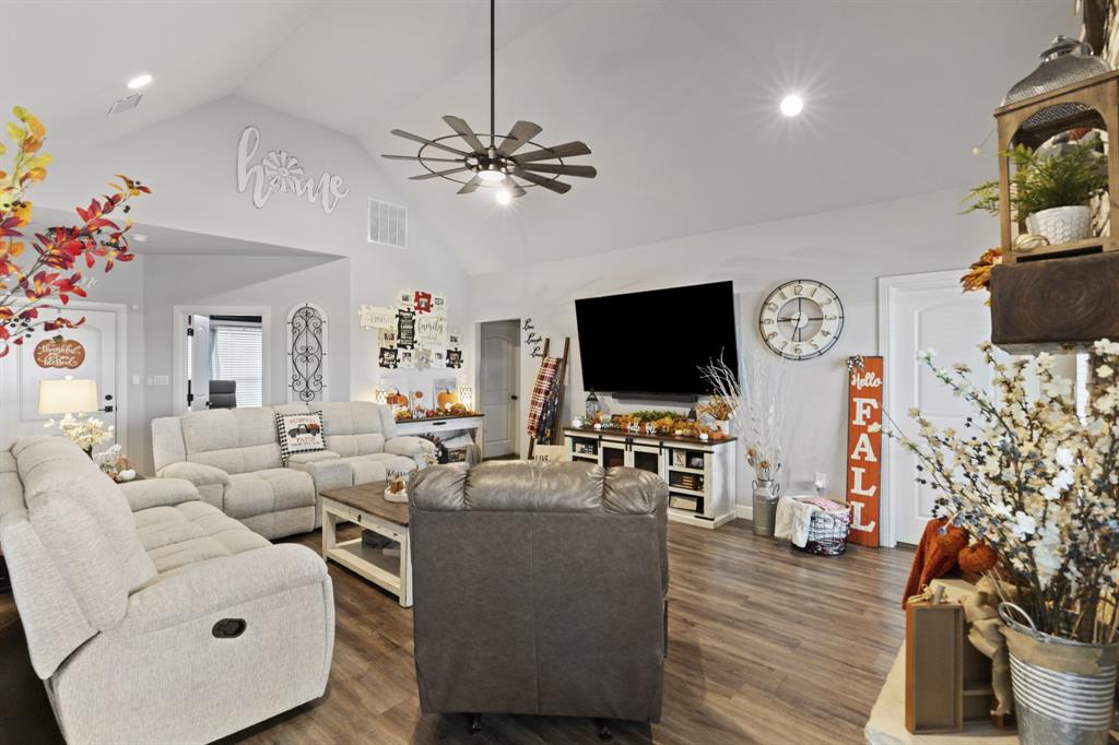 1195 Hog Town Road Collinsville, TX 76233 - Photo 5 of 37 a living room with furniture and a flat screen tv
