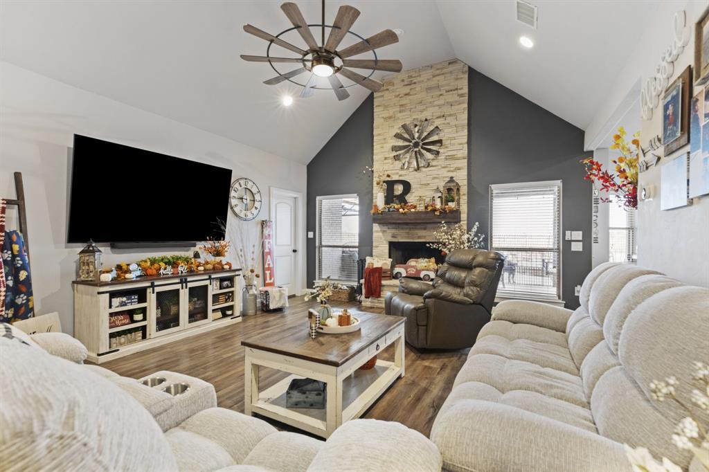 1195 Hog Town Road Collinsville, TX 76233 - Photo 6 of 37 a living room with furniture and a flat screen tv