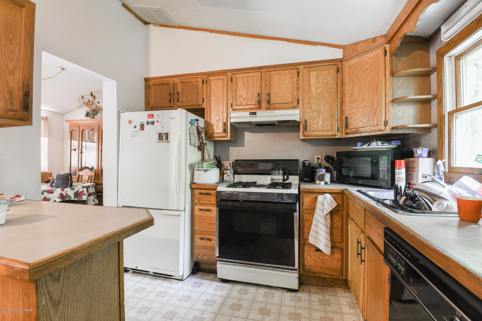 7055 Running Valley Road Stroudsburg, PA 18360 - Photo 11 of 23 a kitchen with stainless steel appliances a stove a sink and a refrigerator
