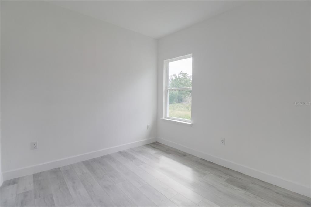 16816 Southwest 41st Avenue Road Ocala, FL 34473 - Photo 13 of 21 an empty room with a window