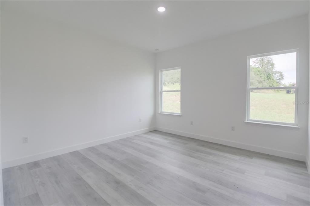16816 Southwest 41st Avenue Road Ocala, FL 34473 - Photo 19 of 21 an empty room with windows