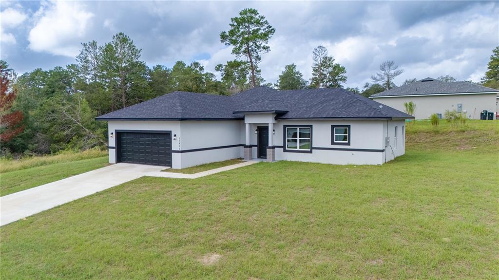 16816 Southwest 41st Avenue Road Ocala, FL 34473 - Photo 3 of 21 a house view with a garden space