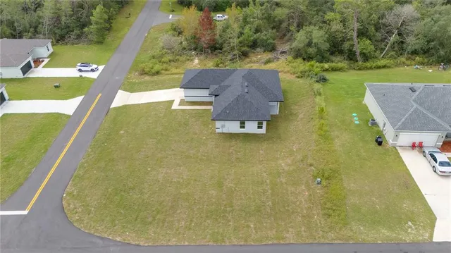 a view of a swimming pool with a yard