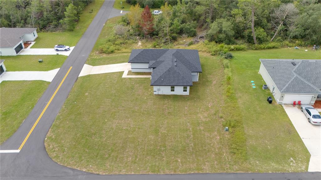 16816 Southwest 41st Avenue Road Ocala, FL 34473 - Photo 4 of 21 a view of a swimming pool with a yard