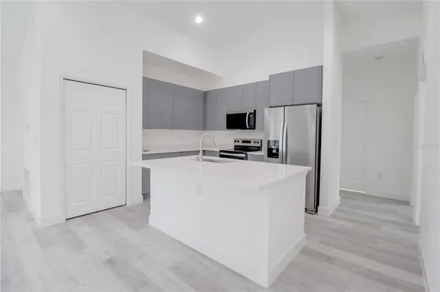 a view of a kitchen with a sink cabinets and a window