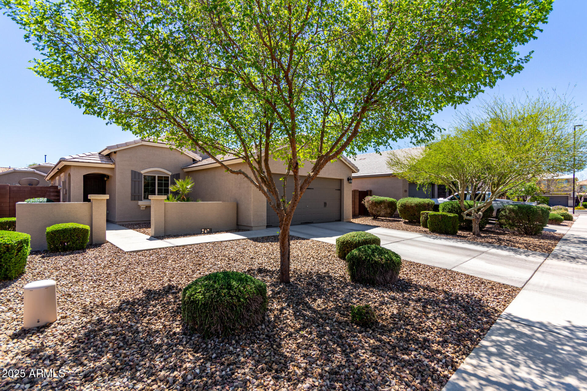 2169 East Gillcrest Road Gilbert, AZ 85298 - Photo 22 of 77 a front view of a house with garden