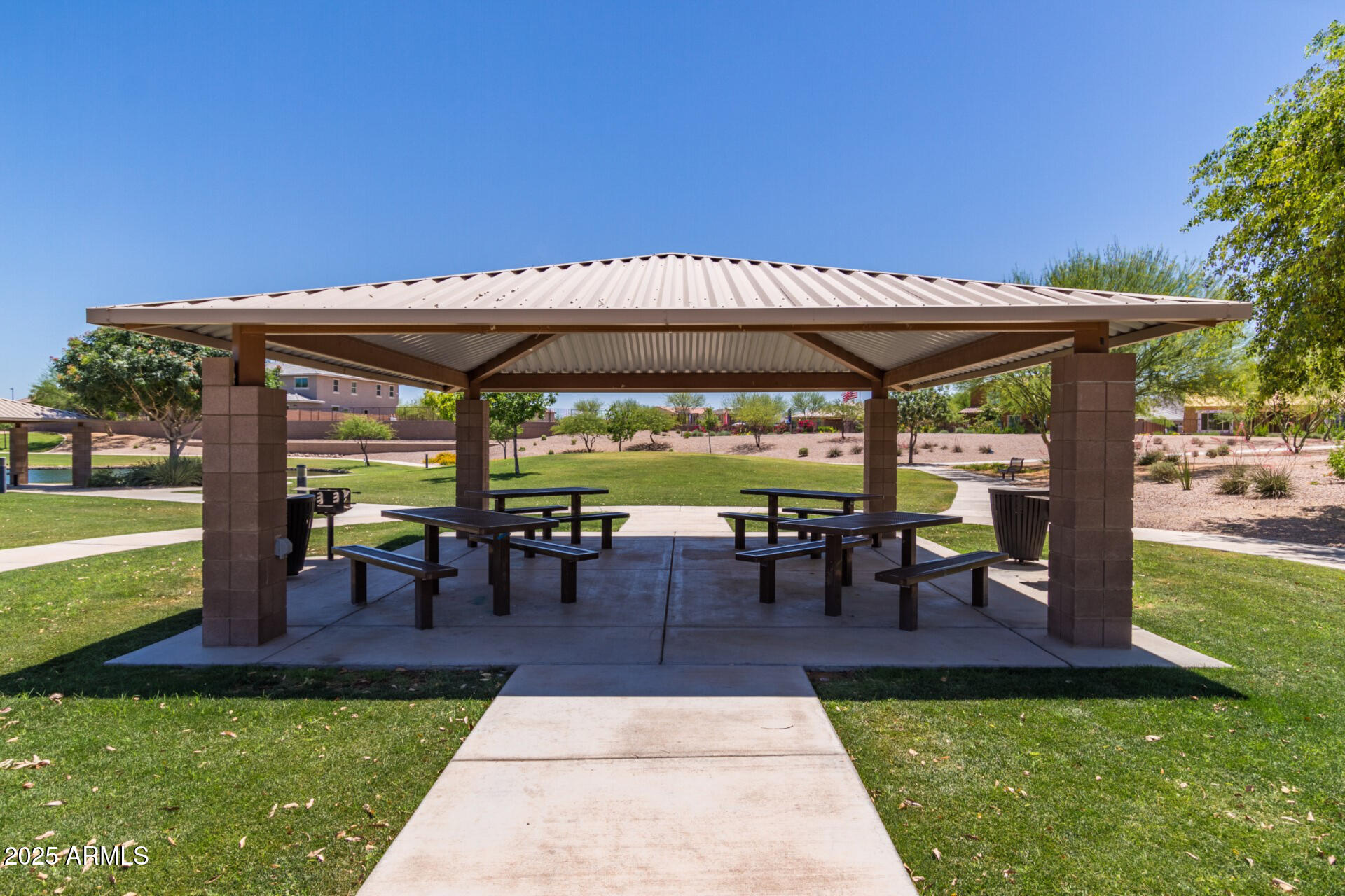 2169 East Gillcrest Road Gilbert, AZ 85298 - Photo 57 of 77 a view of a patio with table and chairs under an umbrella