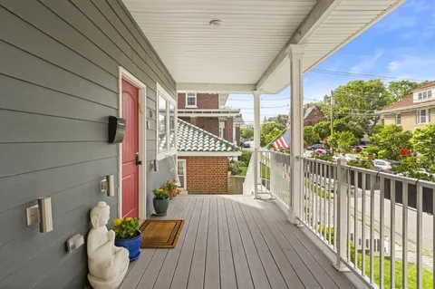 a view of a porch with wooden floor