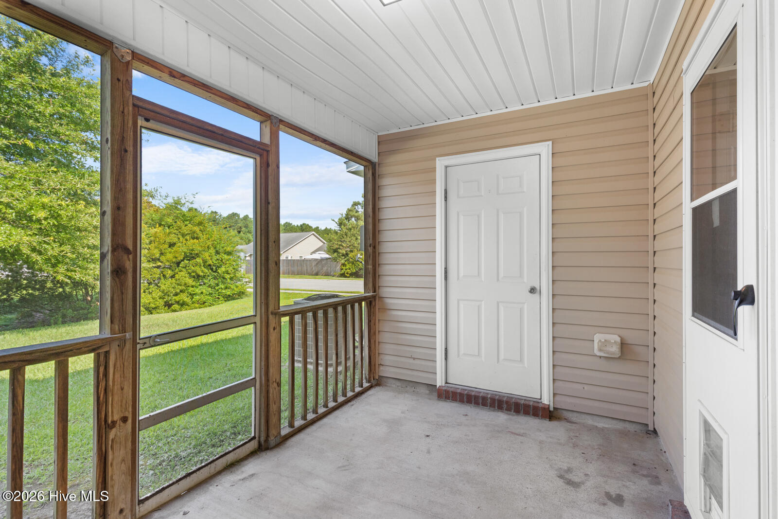 402 Caldwell Loop Jacksonville, NC 28546 - Photo 21 of 27 Screened-In Back Porch