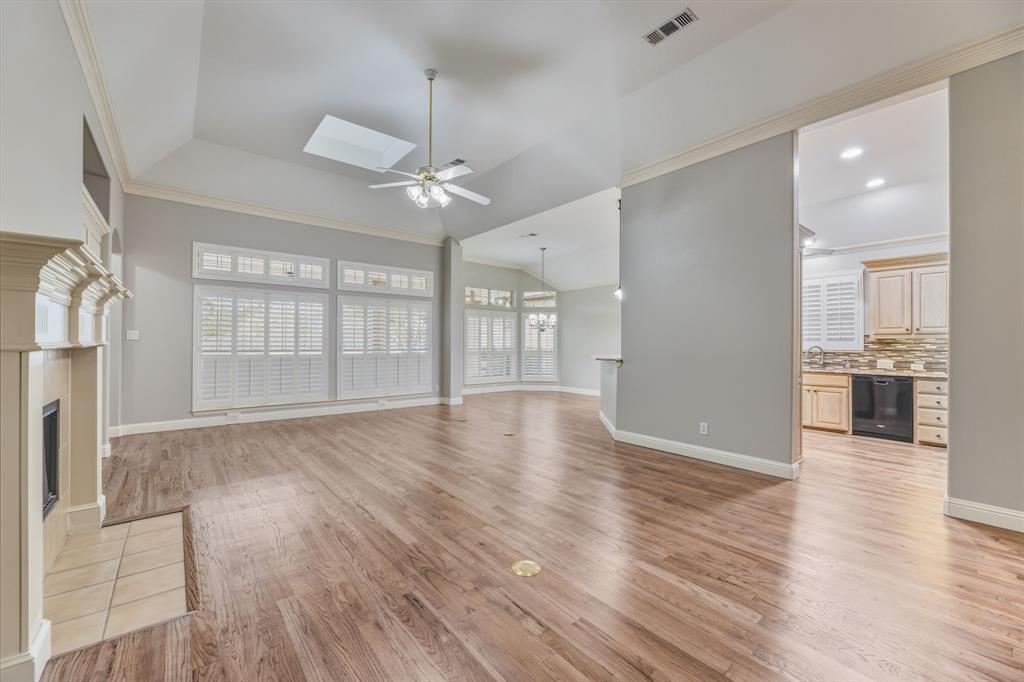 358 Pine Valley Fairview, TX 75069 - Photo 13 of 39 a view of an empty room with wooden floor and a window