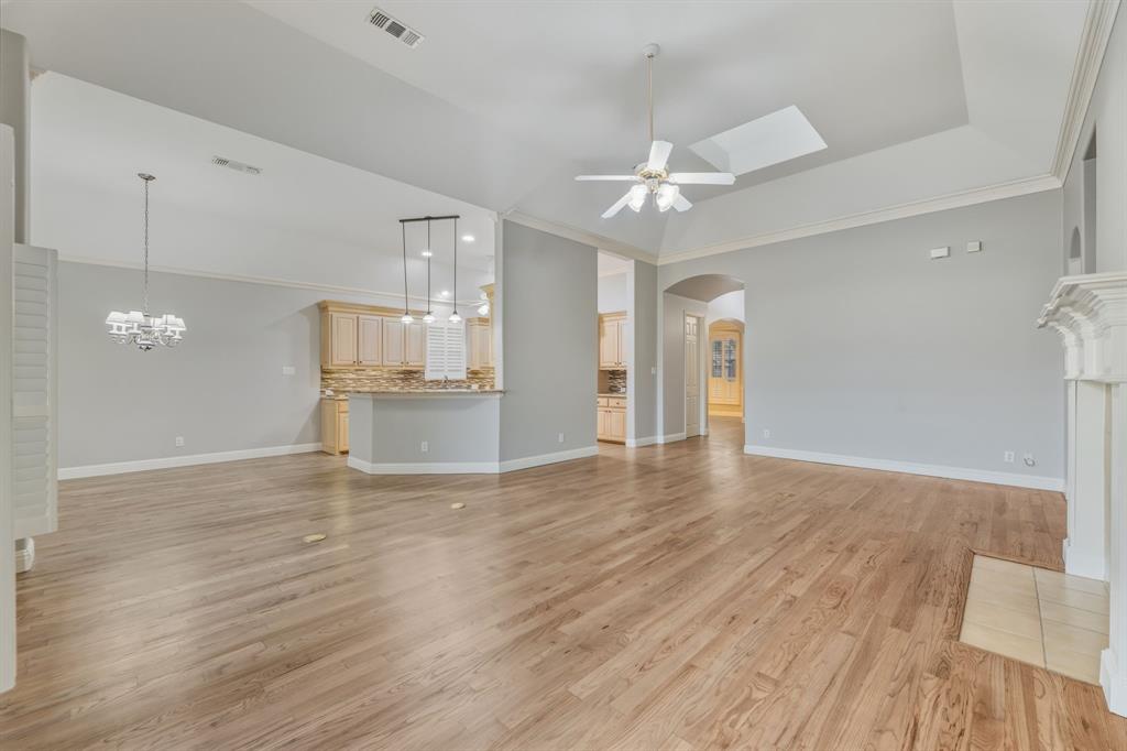 358 Pine Valley Fairview, TX 75069 - Photo 14 of 39 a view of a kitchen with wooden floor and a kitchen