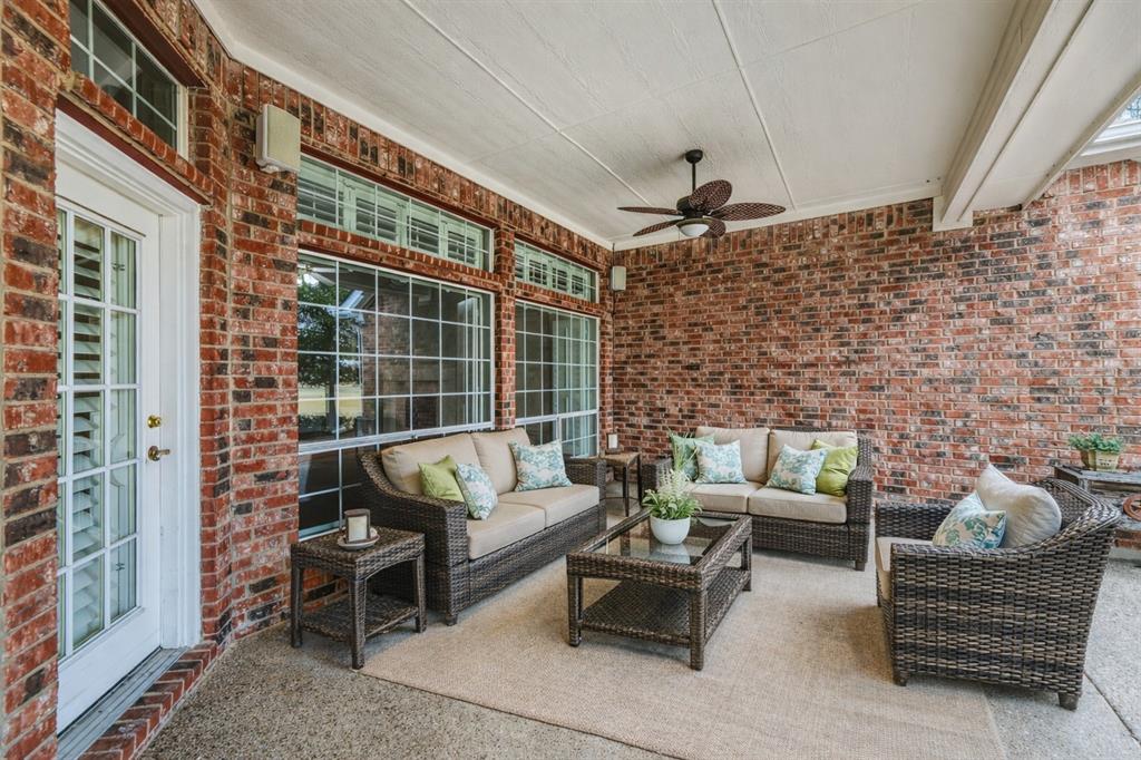 358 Pine Valley Fairview, TX 75069 - Photo 22 of 39 a living room with furniture and a fireplace