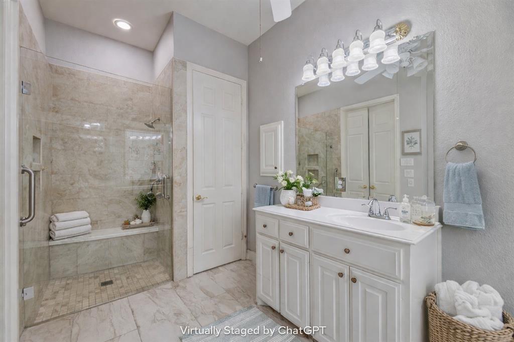 358 Pine Valley Fairview, TX 75069 - Photo 29 of 39 a bathroom with a double vanity sink mirror and shower