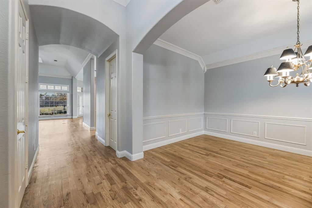 358 Pine Valley Fairview, TX 75069 - Photo 7 of 39 a view of a room with wooden floor and brick walls