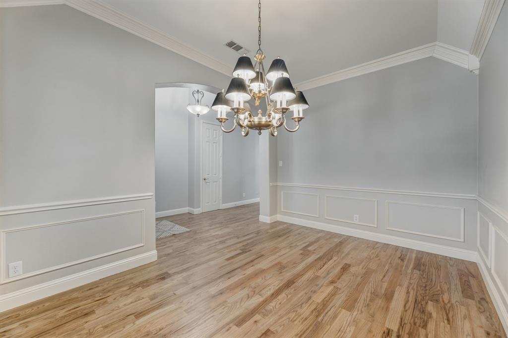 358 Pine Valley Fairview, TX 75069 - Photo 9 of 39 a view of a chandelier in big room with wooden floor