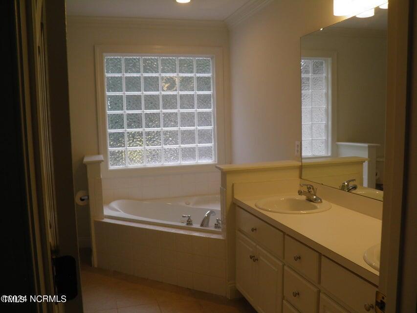 632 Compton Lane Rocky Mount, NC 27804 - Photo 24 of 35 a bathroom with a sink and a bathtub