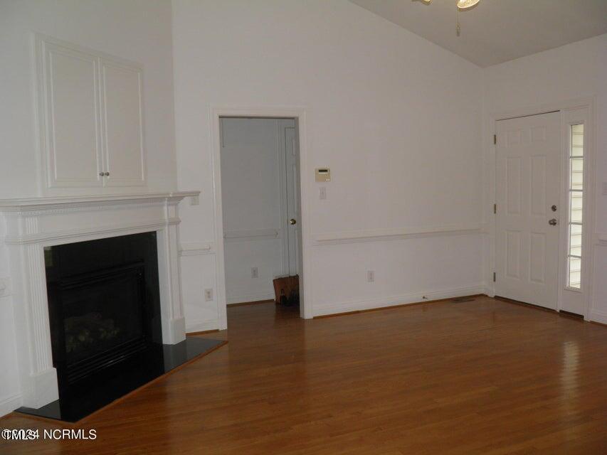 632 Compton Lane Rocky Mount, NC 27804 - Photo 5 of 35 a view of empty room with wooden floor and fireplace