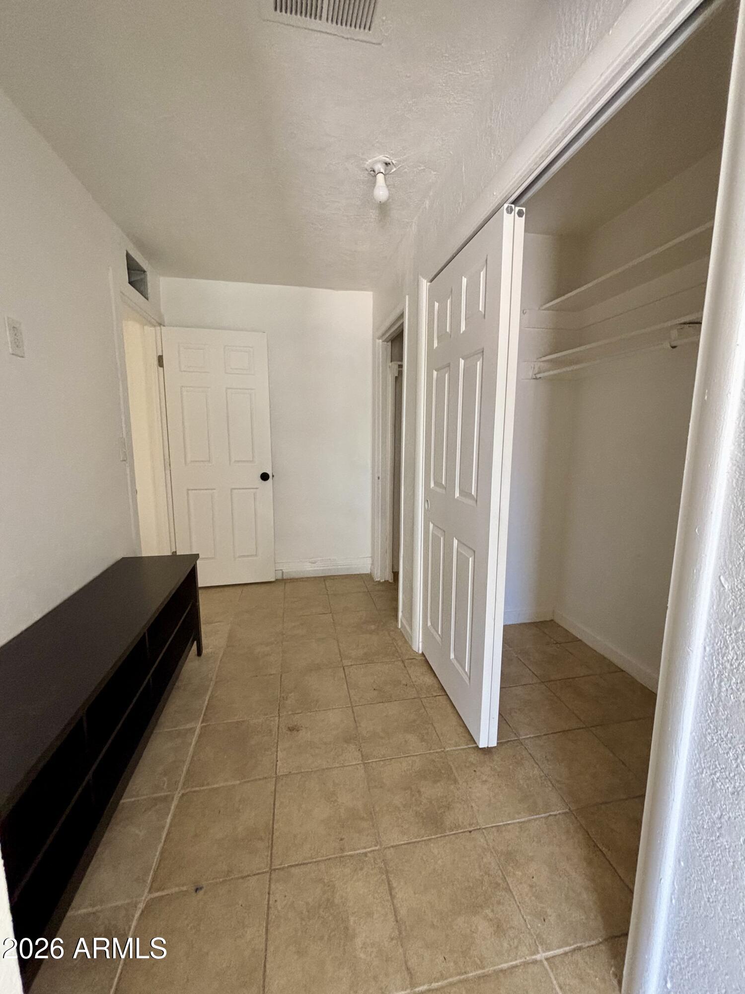 3036 West Almeria Road Phoenix, AZ 85009 - Photo 10 of 20 a view of an empty room