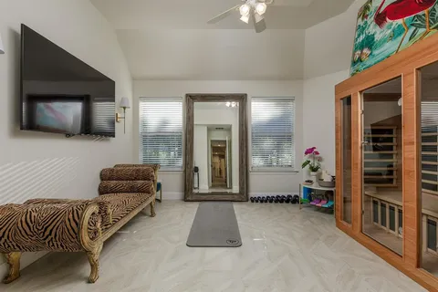 a bathroom with a toilet a sink and a mirror