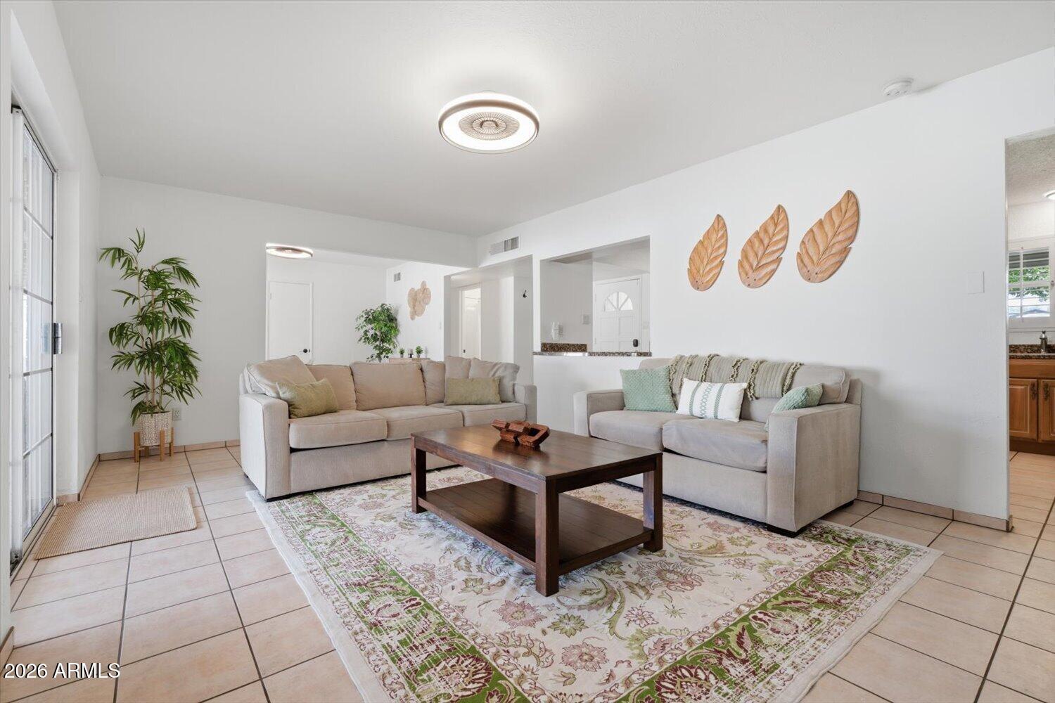 934 East Berridge Lane Phoenix, AZ 85014 - Photo 11 of 29 a living room with furniture and a potted plant