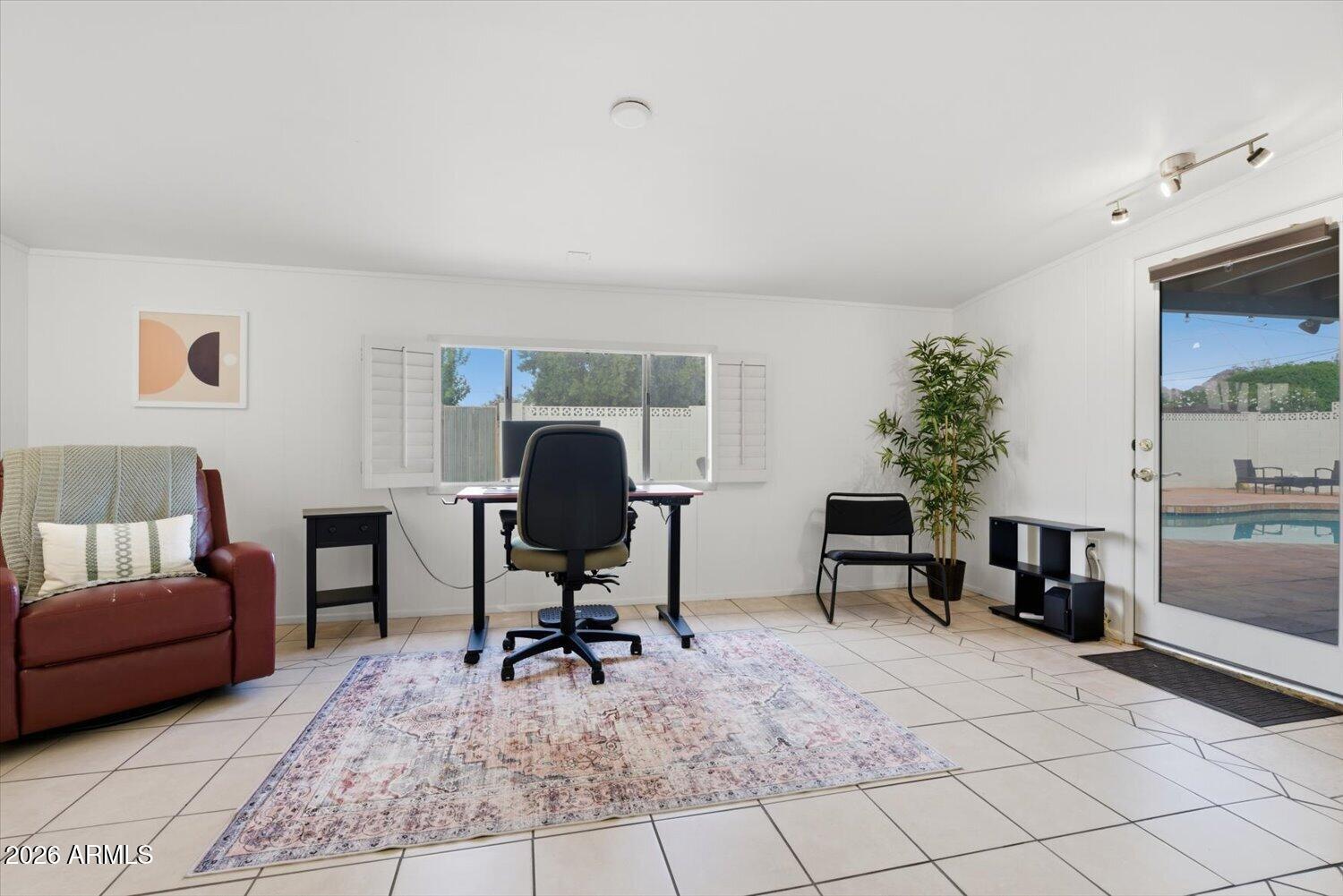 934 East Berridge Lane Phoenix, AZ 85014 - Photo 14 of 29 a living room with furniture and a potted plant