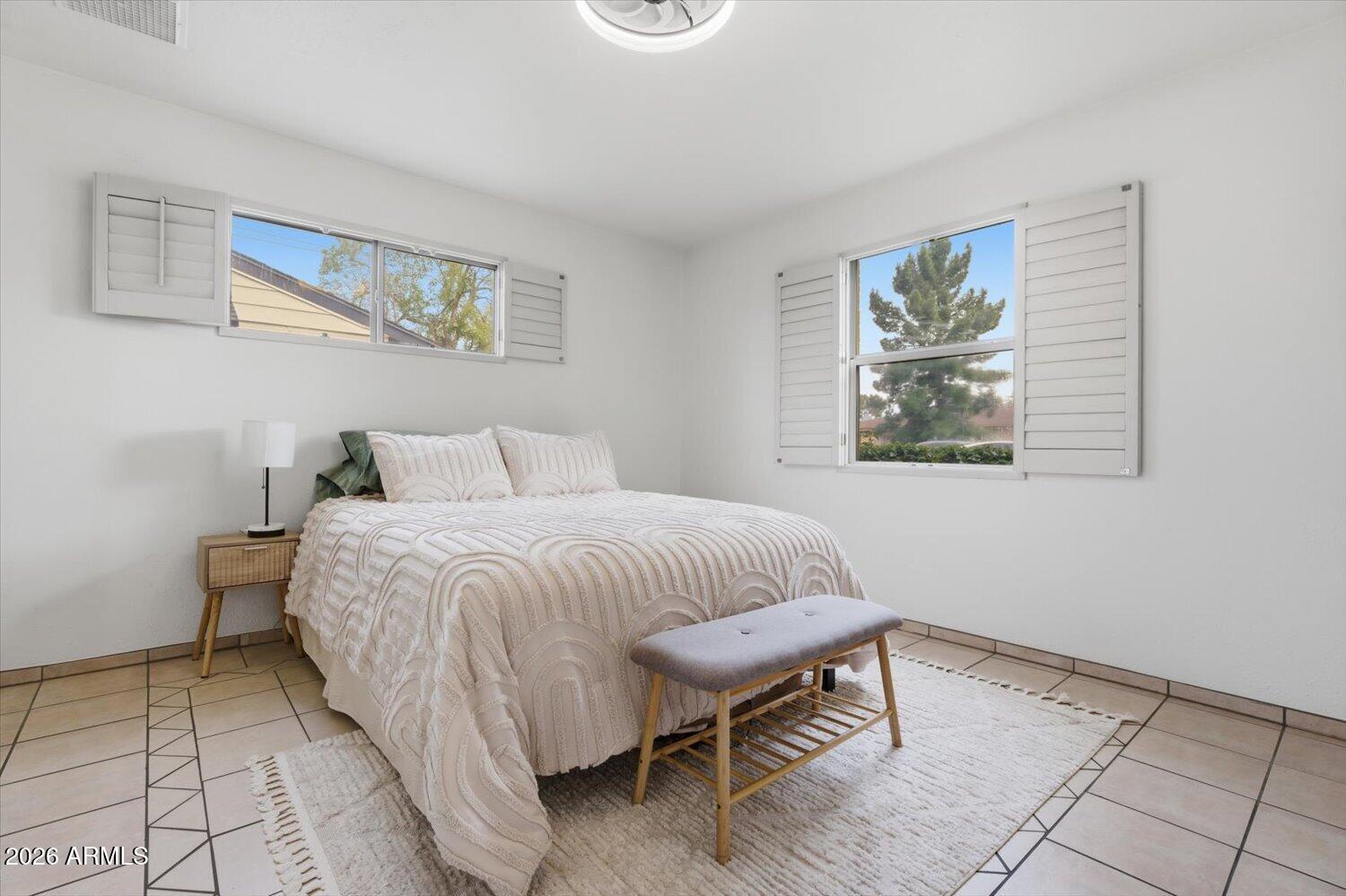 934 East Berridge Lane Phoenix, AZ 85014 - Photo 15 of 29 a bedroom with a bed and a window