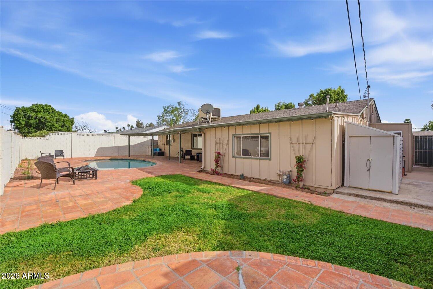 934 East Berridge Lane Phoenix, AZ 85014 - Photo 28 of 29 a view of a house with backyard sitting area and garden