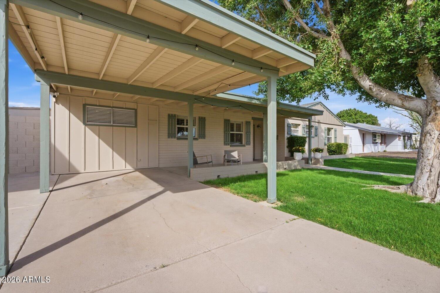 934 East Berridge Lane Phoenix, AZ 85014 - Photo 4 of 29 a house with sign broad in front of it