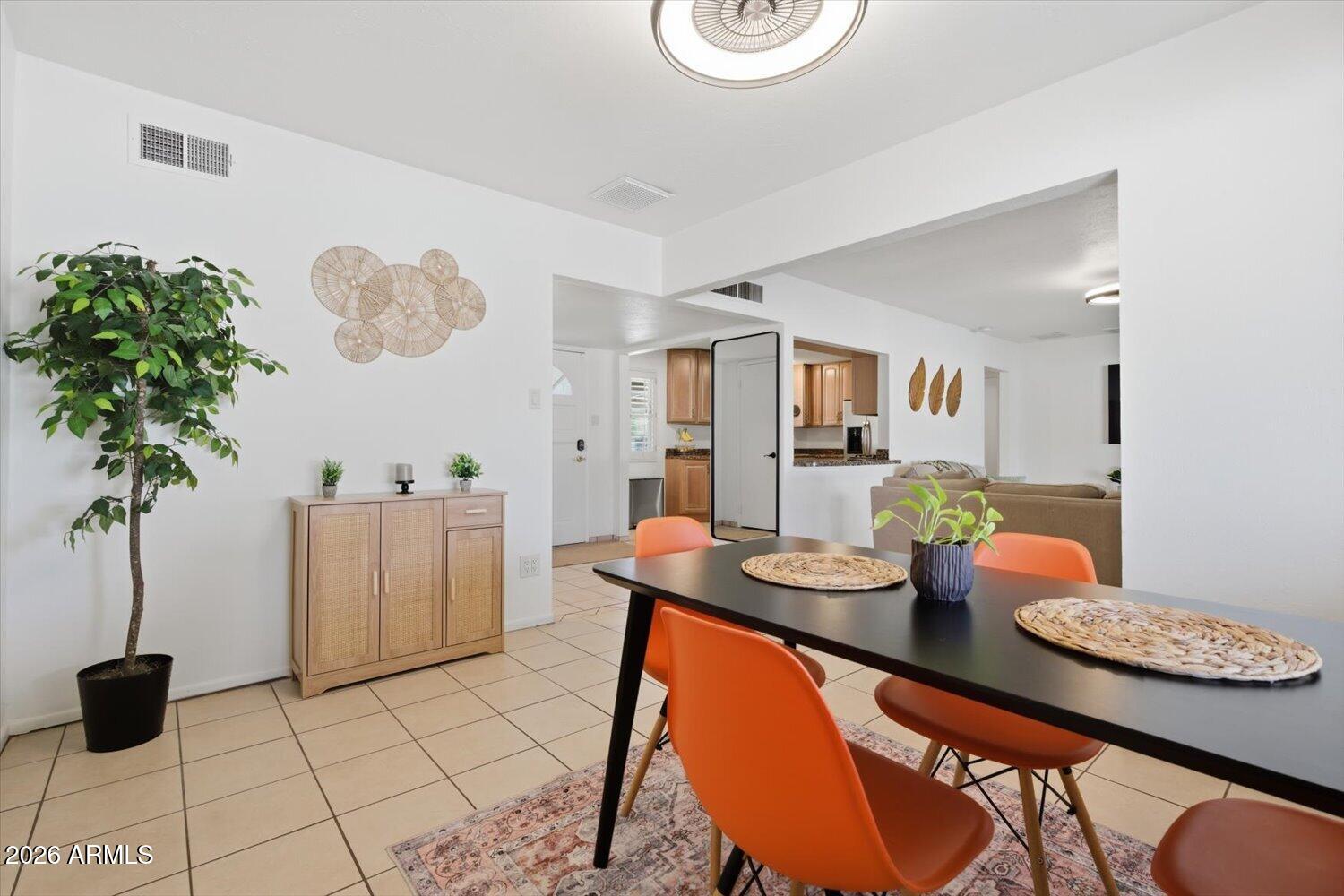 934 East Berridge Lane Phoenix, AZ 85014 - Photo 9 of 29 a dining room with furniture and a potted plant