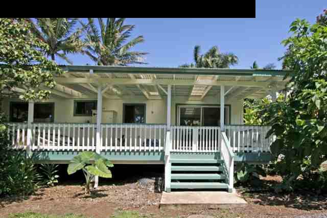 1355 Haiku Road Haiku, HI 96708 - Photo 23 of 30 a view of a house with a small yard and a wooden fence