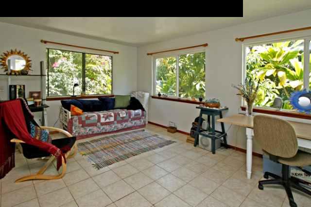 1355 Haiku Road Haiku, HI 96708 - Photo 25 of 30 a living room with furniture and a large window
